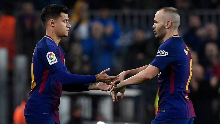 Philippe Coutinho and Andrés Iniesta greet  during a replacement