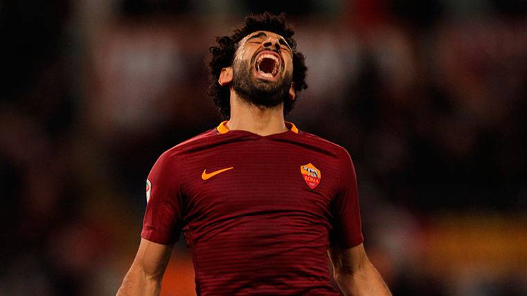 Mohamed Salah celebrates a goal with the Rome