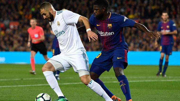 Samuel Umtiti, defending to the Barça against Benzema in an action