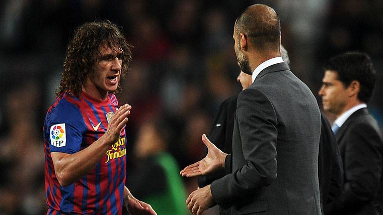 Carles Puyol y Pep Guardiola en un partido del FC Barcelona