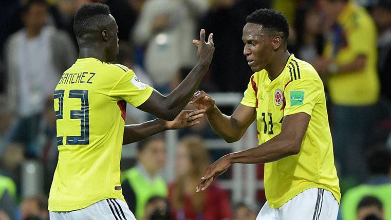 Davinson Sánchez and Yerry Mina celebrate a goal of Colombia