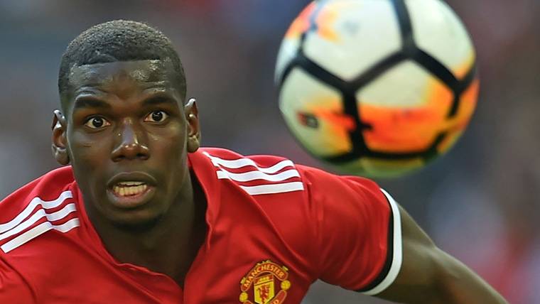 Paul Pogba, struggling by a balloon in the Manchester United
