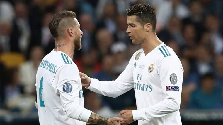 Sergio Bouquets and Cristiano Ronaldo argue during a party of the Real Madrid