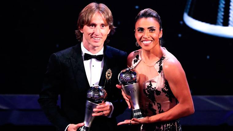 Luka Modric And Marta pose with his trophies of the The Best