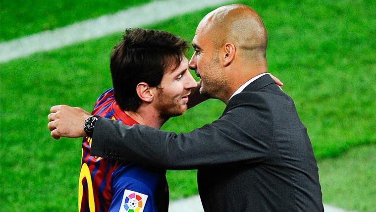 Leo Messi and Pep Guardiola greet  during a party of Champions