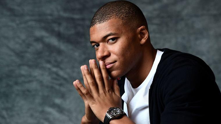 Kylian Mbappé, posing for a session of photos
