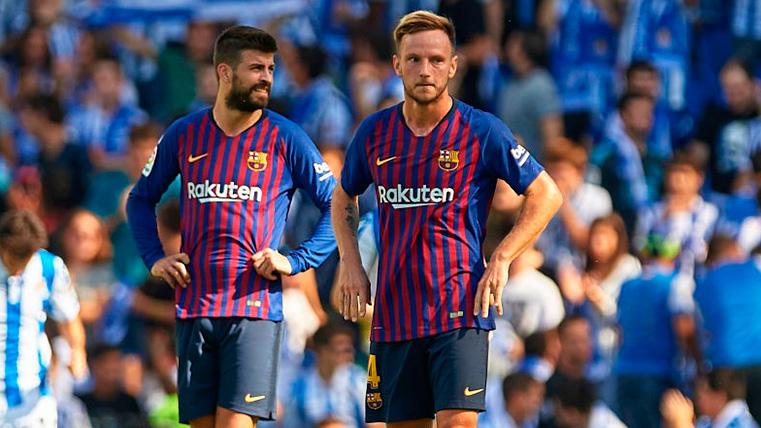 Piqué y Rakitic en un partido con el Barcelona