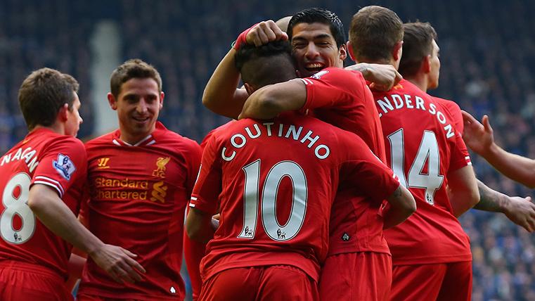 Philippe Coutinho and Luis Suárez, celebrating a goal with the Liverpool
