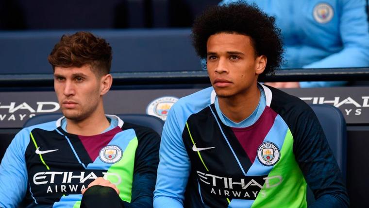 John Stones and Leroy Sané in the bench of the Manchester City