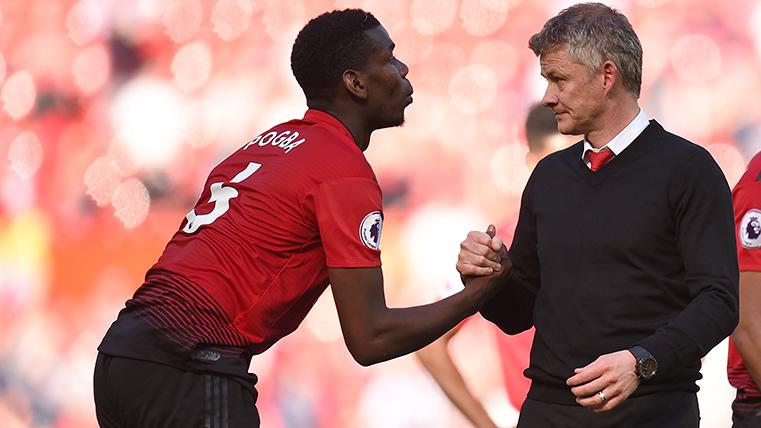 Paul Pogba and Ole Gunnar Solskjaer, in an image of archive