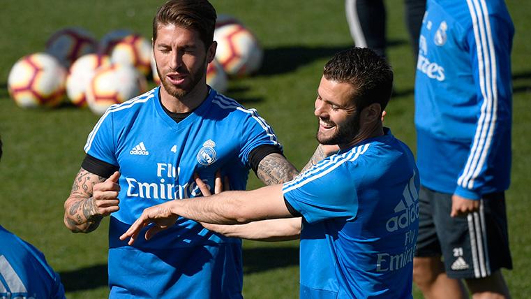 Sergio Bouquets and Nacho, during a training of the Real Madrid