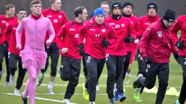 A Scottish player has been punished by his mates to go to train dress of dancer