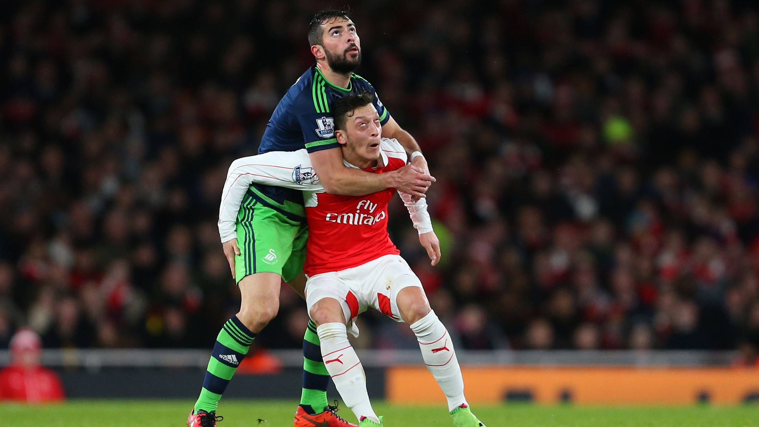 Amat, struggling by a balloon with Özil