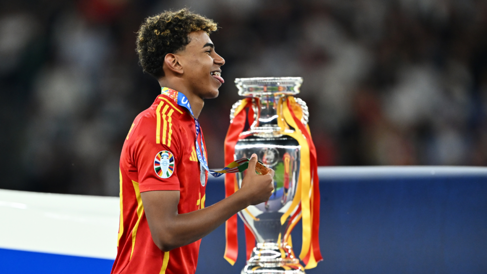 Lamine Yamal lifting the trophy as champion of Euro 2024 with the Spanish national team Lamine Yamal lifting the trophy as champion of Euro 2024 with the Spanish national team