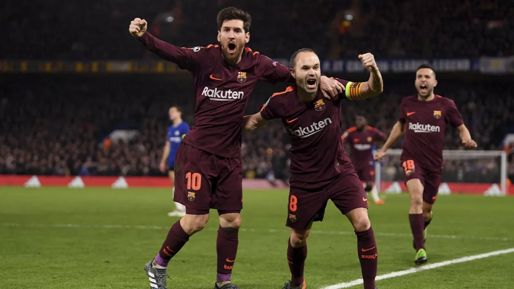 Leo Messi and Andrés Iniesta celebrating a goal against Chelsea