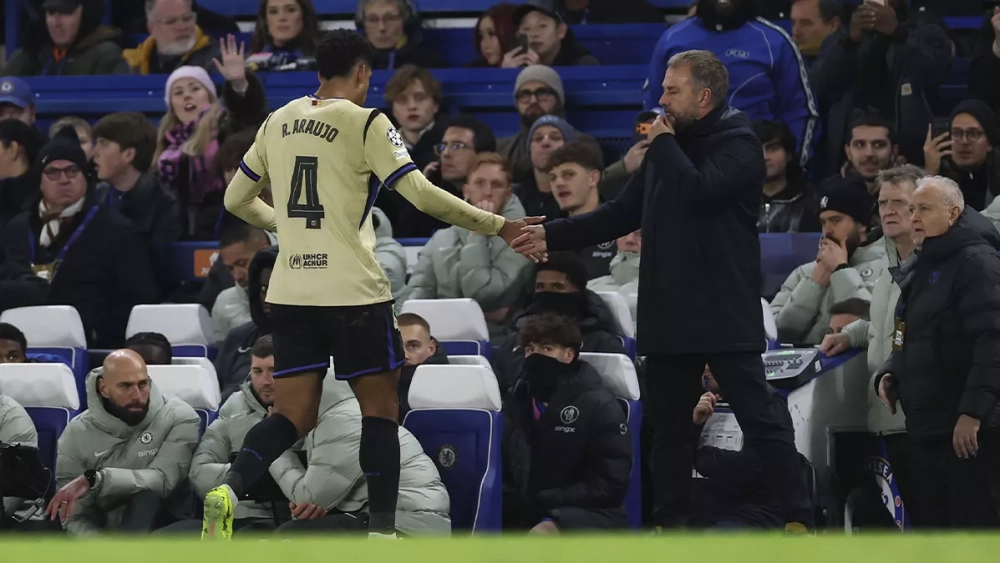 Ronald Araujo greets Hansi Flick after being sent off against Chelsea